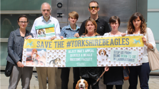 Group of campaign supporters holding Save the #YorkshireBeagles banner