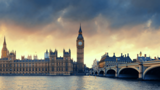 View of Westminster UK Parliament across Thames River in London