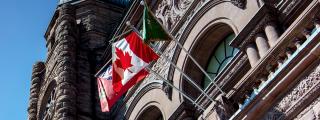 Canadian flag on the outside of building