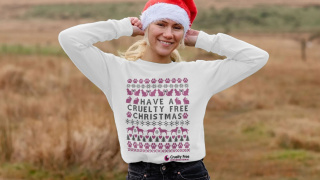 Blonde woman wearing cruelty-free Christmas jumper