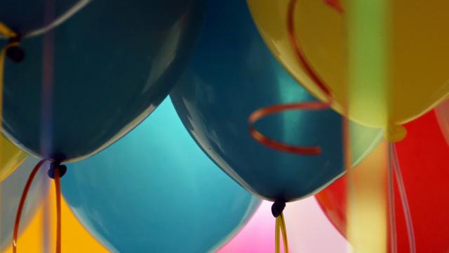 Close up of green, blue, pink and orange balloons